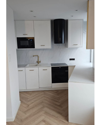 White kitchen with milled cabinet fronts, Leszno