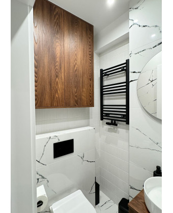 Custom bathroom furniture. Custom cabinetry above a Geberit unit in Leszno