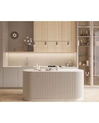 A modern kitchen with a grooved island, light gray cabinet fronts, and cabinets made of natural oak veneer, featuring a warm des