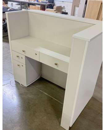 A rounded reception desk with a grooved front—modern and elegant