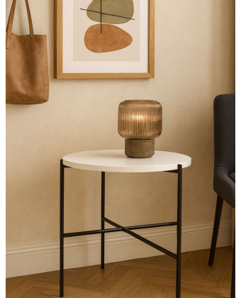 Round side table with a white tabletop and metal base – a minimalist coffee table for the living room