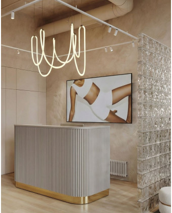 A rounded reception desk with a grooved front—modern and elegant
