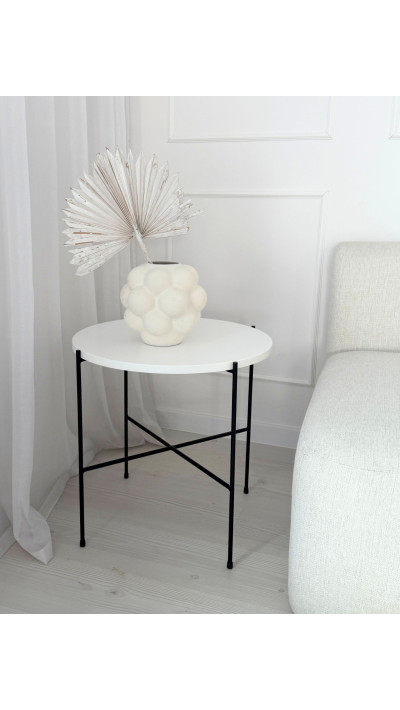 White round coffee table with black legs, modern coffee table for the living room, table for a sofa or corner sofa White round coffee table with black legs, modern coffee table for the living room, table for a sofa or corner sofa