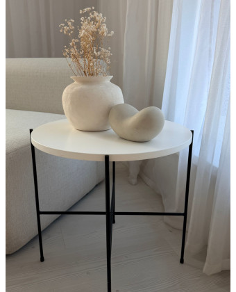 White round coffee table with black legs, modern coffee table for the living room, table for a sofa or corner sofa White round coffee table with black legs, modern coffee table for the living room, table for a sofa or corner sofa
