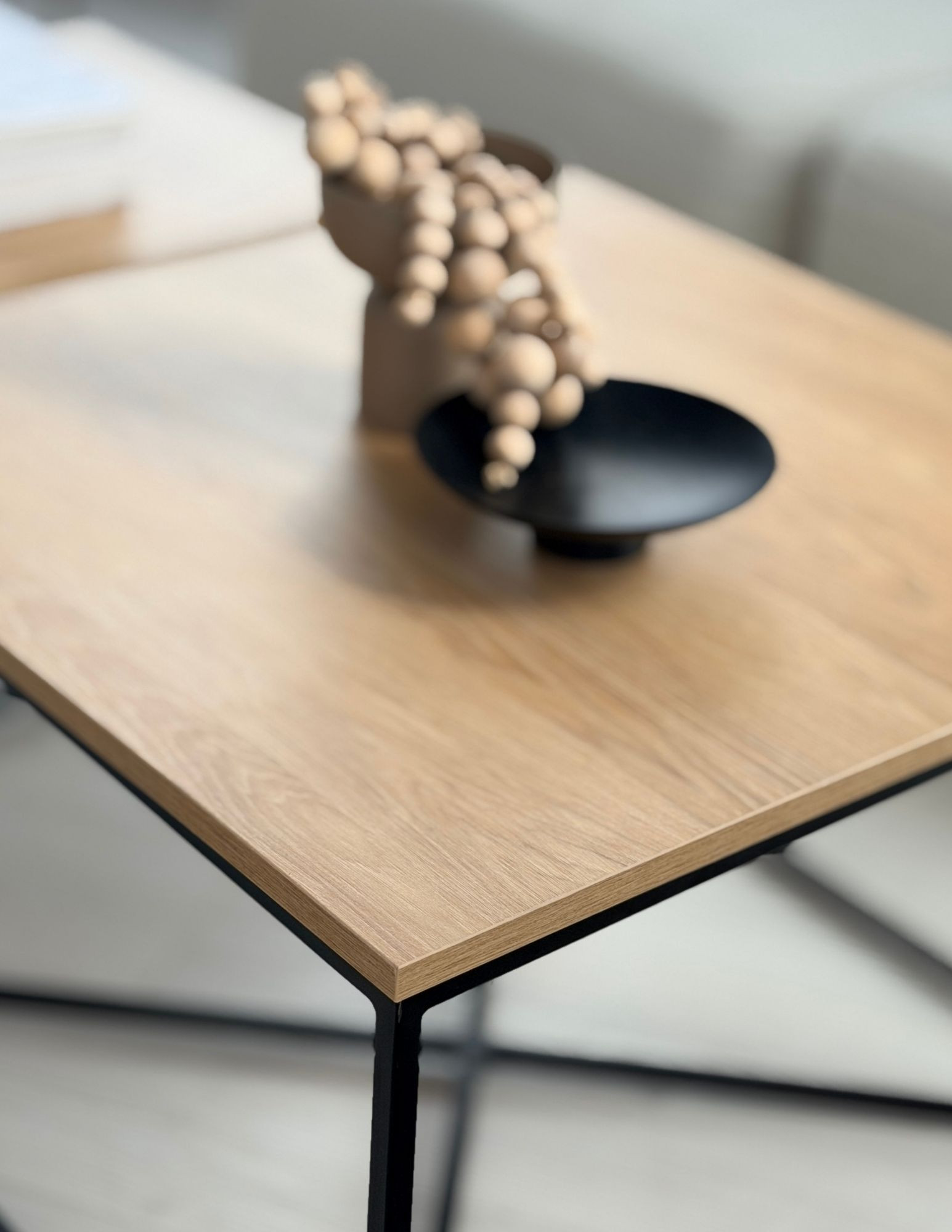 industrial coffee table with an oak top and black metal frame