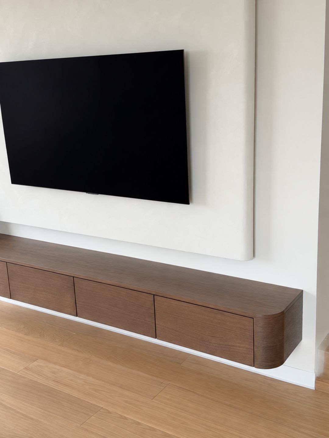 The LAVENA modern wall-mounted TV cabinet with rounded sides